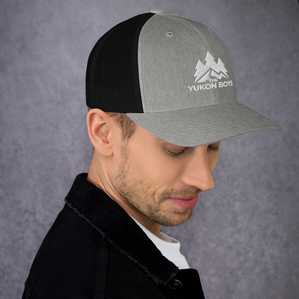 The Yukon Boys Trucker Cap in Heather Black, right side view