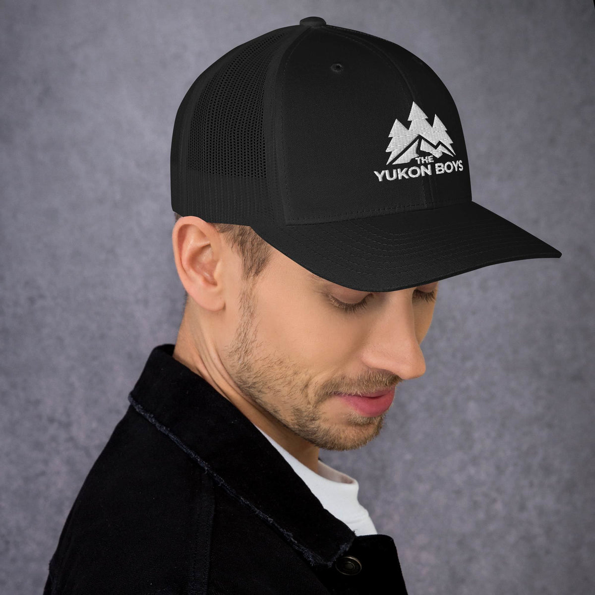 The Yukon Boys Trucker Cap in Black, right side view