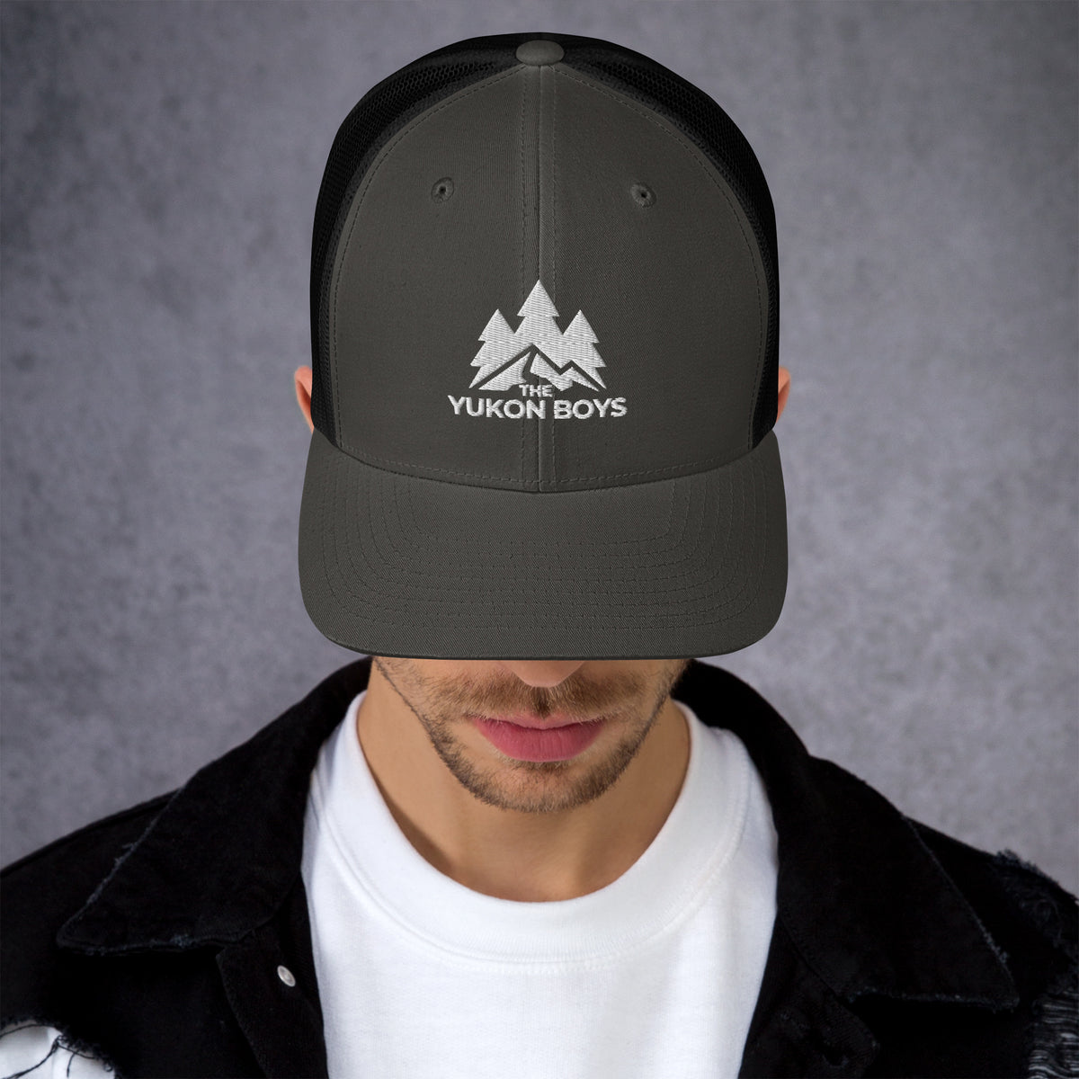 The Yukon Boys Trucker Cap in Charcoal Black, front view