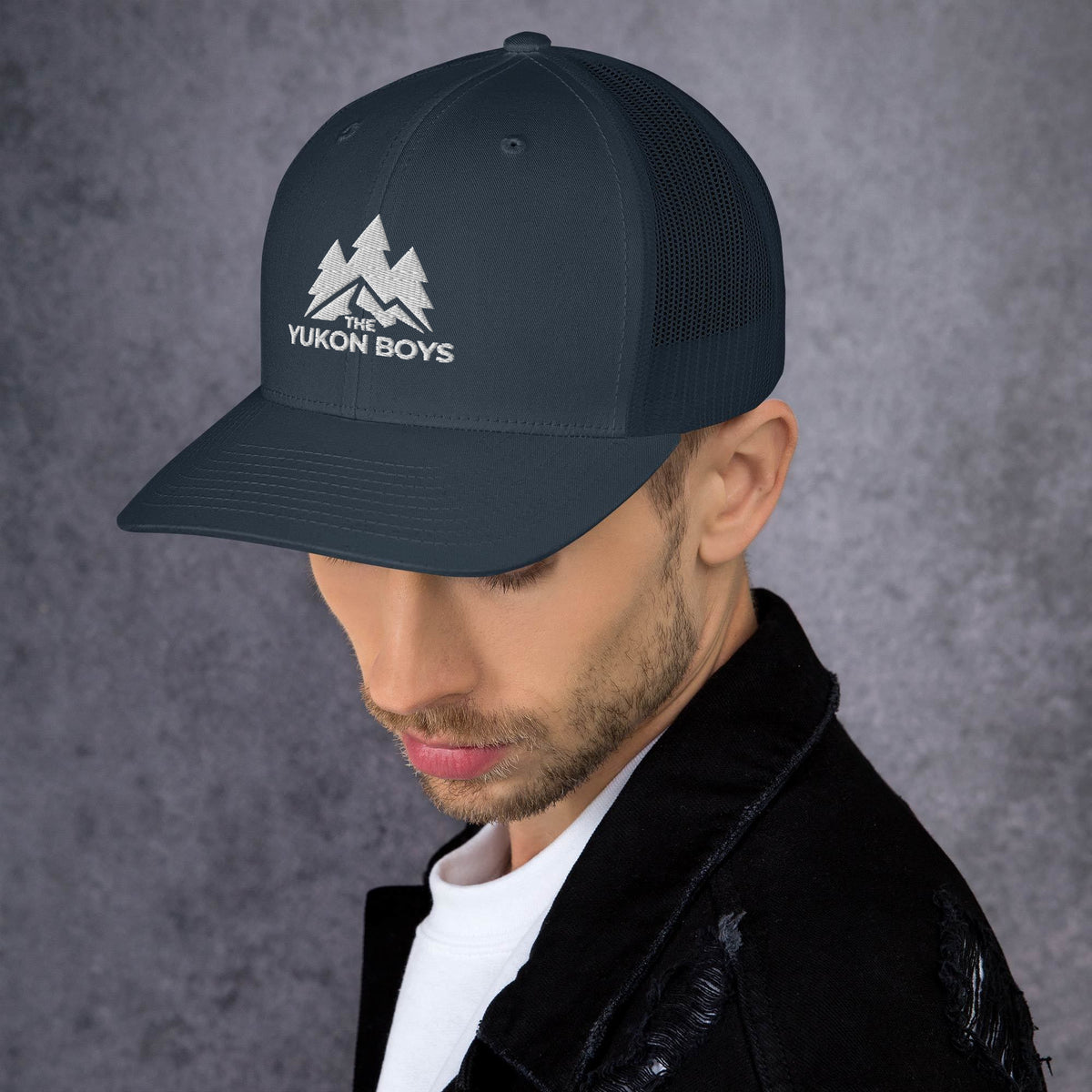 The Yukon Boys Trucker Cap in Navy, left side view